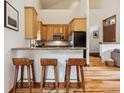 Cozy kitchen with breakfast bar and access to living space at 1152 Ski Hill Rd, Breckenridge, CO 80424
