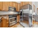 Well-equipped kitchen with stainless steel appliances and warm wood cabinetry at 1152 Ski Hill Rd, Breckenridge, CO 80424