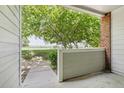 View from a condo patio with a green lawn and trees in the background at 10129 W 55Th Dr # 3, Arvada, CO 80002