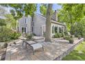 Paver patio with lounge chairs and a grill, perfect for outdoor entertaining at 1540 W Briarwood Ave, Littleton, CO 80120