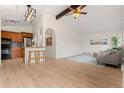 Inviting living room featuring wood floors, a stylish ceiling, an open layout, and abundant natural light at 712 S Longmont Ave, Lafayette, CO 80026
