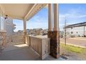 View from the front porch showcasing the neighborhood and manicured landscaping at 20145 E Fair Ln, Centennial, CO 80016
