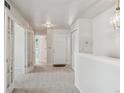 Bright entryway featuring fresh paint and plush carpeting at 9214 Winona Ct, Westminster, CO 80031
