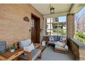 Cozy covered front porch with comfortable seating and stylish decor at 1265 Saint Paul St, Denver, CO 80206