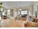 Bright, open living room with hardwood floors and large windows offers ample natural light at 165 Washington St, Golden, CO 80403