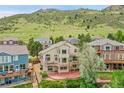 Spacious home with a large deck overlooks a green landscape and mountain view at 165 Washington St, Golden, CO 80403