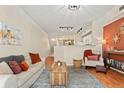 Inviting living room with a cozy sofa, decorative rug, and warm lighting for a relaxed atmosphere at 2169 Eagle Ave # 2169, Superior, CO 80027