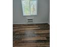 This bedroom has updated flooring, a window and air conditioning at 1304 S Parker Rd # 13, Denver, CO 80231