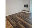 This living room has a fireplace, updated flooring and access to a balcony at 1304 S Parker Rd # 13, Denver, CO 80231
