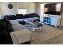 Spacious living room with a large sectional sofa and modern decor at 3993 Haddon Rd, Denver, CO 80205