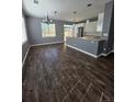 Bright dining room featuring hardwood floors, large windows and modern light fixtures at 1347 Carlyle Park Cir, Highlands Ranch, CO 80129