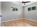 Bright bedroom with hardwood floors and ceiling fan at 181 E 108Th Ave, Northglenn, CO 80233