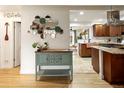 Stylish dining area with decorative mirror accents and open flow to the adjacent kitchen at 1891 S Madison St, Denver, CO 80210