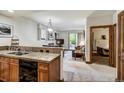 Open-concept living area flows from kitchen to living room with backyard access at 34 Highfield Trl # 112, Breckenridge, CO 80424