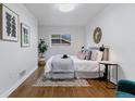 Cozy bedroom with a comfortable bed, stylish decor, and ample natural light at 4003 Federal Blvd, Denver, CO 80211