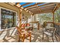 Relaxing front porch with comfortable seating, a decorative pergola, and a sunny view at 1141 Beech St, Fort Lupton, CO 80621