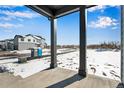 View from the front porch of a property under construction in a snow covered field at 1525 E 3Rd Ave, Longmont, CO 80501