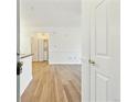 Inviting entryway with modern wood flooring and white walls, offering a bright and clean ambiance at 2705 S Danube Way # 101, Aurora, CO 80013