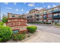 Lincoln Square Lofts features brick facade, manicured greenery, and building signage at 10184 Park Meadows Dr # 1303, Lone Tree, CO 80124