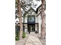Charming home entrance with modern architectural details and beautiful landscaping at 62 Jasmine St, Denver, CO 80220