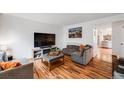Cozy living room with hardwood floors and comfortable seating at 12956 W Virginia Ave, Lakewood, CO 80228