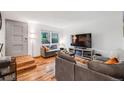 Inviting living room with hardwood floors and natural light at 12956 W Virginia Ave, Lakewood, CO 80228