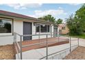 A charming home featuring a cozy porch and well-maintained landscaping at 1436 S Yates St, Denver, CO 80219