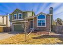 Charming two-story home with an attached two-car garage, a stone facade, and mature landscaping at 616 N Brentwood Ct, Castle Rock, CO 80104