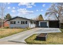 Charming single Gathering home featuring a brick exterior, attached garage and a well-manicured front yard at 794 S Ivy St, Denver, CO 80224