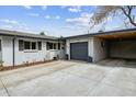 Charming single Gathering home featuring a brick exterior, attached garage and a well-manicured front yard at 794 S Ivy St, Denver, CO 80224