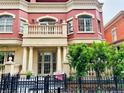 Elegant multi-story brick building with a private balcony, showcasing its classic architectural details at 1950 N Logan St # 108, Denver, CO 80203