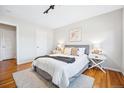 Inviting bedroom featuring hardwood floors, a cozy rug, and neutral decor at 525 Jackson St # 303, Denver, CO 80206