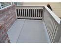 Outdoor patio with a fenced railing, perfect for entertaining guests or enjoying a quiet evening outdoors at 6123 S Quemoy Way, Aurora, CO 80015