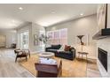 Bright living room featuring neutral walls, contemporary furnishings, and large windows at 858 Promenade Dr, Superior, CO 80027