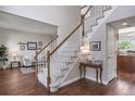 Entryway with hardwood floors and a carpeted staircase at 9810 Townsville Cir, Highlands Ranch, CO 80130