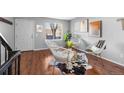 Bright living room showcasing hardwood floors and a cozy seating area at 17698 E Loyola Dr # E, Aurora, CO 80013