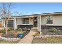 Inviting front entrance featuring a well-maintained landscape and a paved pathway leading to the front door, enhancing curb appeal at 15756 E Temple Pl, Aurora, CO 80015