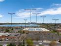 Aerial view showcases the property's proximity to Downtown Denver, Broncos Stadium and Sloans Lake at 1890 Eaton St, Lakewood, CO 80214