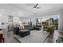 An open-concept floorplan featuring recessed lighting, wood floors, and access to the outdoor living space at 20272 Terrace View Dr, Parker, CO 80134