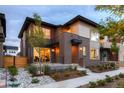 Beautiful two-story home with brick accents, landscaped front yard, and inviting porch at 370 S Glencoe St, Denver, CO 80246