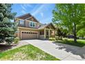 Beautiful two-story home with a manicured lawn and inviting curb appeal at 17332 E Lake Ln, Aurora, CO 80016
