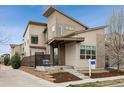 Stylish modern home featuring a welcoming front porch, a neatly landscaped yard, and a 'For Sale' sign at 6631 Alan Dr, Denver, CO 80221