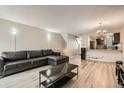 Open living room and kitchen with a view of the kitchen island at 1475 S Quebec Way # H38, Denver, CO 80231