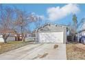 A charming single-Gathering home featuring an attached two-car garage and front yard at 19003 E Oxford Dr, Aurora, CO 80013