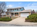 Traditional two-story home with a spacious driveway and attached two-car garage at 4653 Kirkwood St, Boulder, CO 80301
