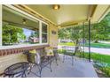 Inviting front porch with seating area, perfect for relaxing and enjoying the neighborhood views at 1600 Olive St, Denver, CO 80220