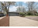 Exterior shot of a well-kept home with a spacious driveway leading to a convenient two-car garage at 3179 S University Blvd, Englewood, CO 80113