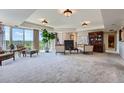 Spacious living room featuring large windows with scenic views and neutral decor at 1900 E Girard Pl # 908, Englewood, CO 80113