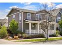 Beautiful home with a covered front porch, mature trees, and inviting curb appeal at 3476 Beeler Ct, Denver, CO 80238
