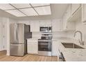 Bright kitchen boasts stainless steel appliances and granite countertops for a modern touch at 13992 E Marina Dr # 109, Aurora, CO 80014